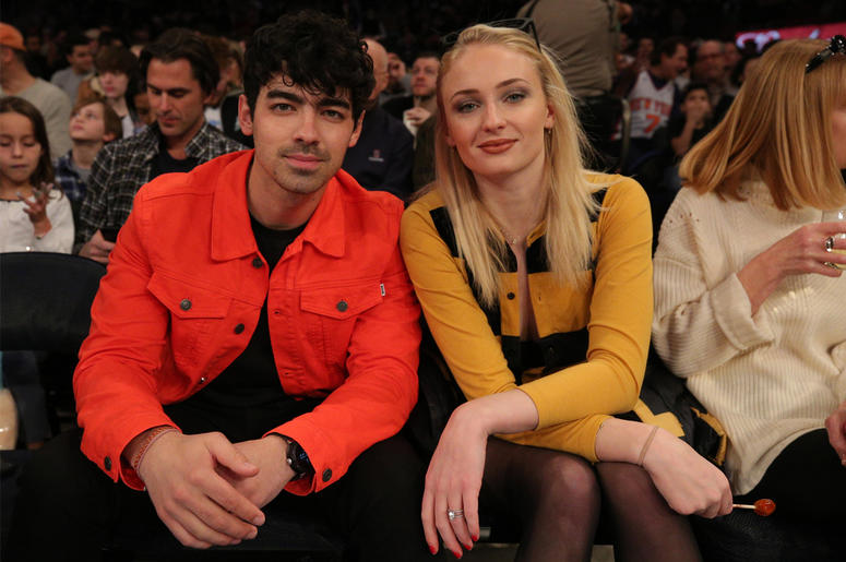 Joe Jonas and fiance Sophie Turner Mar 9, 2019; New York, NY, USA; American musician Joe Jonas (left) sits with British actress Sophie Turner during the first quarter between the New York Knicks and the Sacramento Kings at Madison Square Garden. Mandatory Credit: Brad Penner-USA TODAY Spor