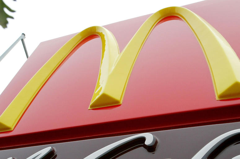 McDonald's MOUNTAIN VIEW, CA - DECEMBER 3: An exterior sign of a new McCafe coffeehouse is shown December 3, 2003 in Mountain View, California. McDonald's unveiled the first McCafe on the west coast and the third in the nation in an attempt to compete with the likes
