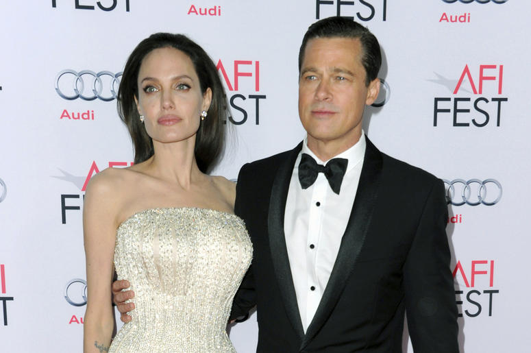 AP18219823029778 In this Nov. 5, 2015 file photo, Angelina Jolie, left, and Brad Pitt arrive at the 2015 AFI Fest opening night premiere of "By The Sea" in Los Angeles. Jolie Pitt says she wants her divorce from Brad Pitt finalized before the end of the year, and that she