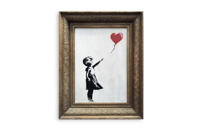 'Girl with Balloon' by artist Banksy In this undated photo provided by Sotheby's the spray-painted canvas 'Girl with Balloon' by artist Banksy is pictured. Art prankster Banksy has struck again. A work by the elusive street artist self-destructed in front of startled auction-goers on Friday,