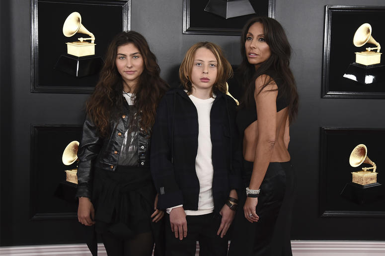 AP19041788422691 Toni Cornell, from left, Christopher Nicholas Cornell, and Vicky Karayiannis arrive at the 61st annual Grammy Awards at the Staples Center on Sunday, Feb. 10, 2019, in Los Angeles. (Photo by Jordan Strauss/Invision/AP)