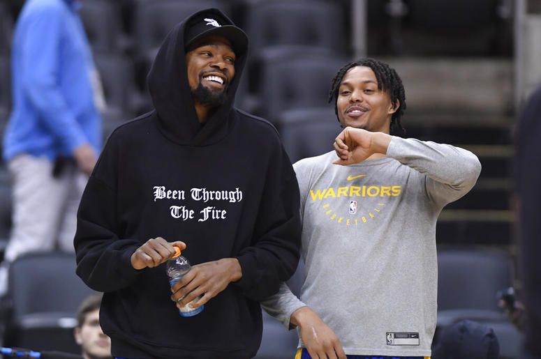 Golden State Warriors Kevin Durant laughs with teammate Damion Lee Golden State Warriors Kevin Durant laughs with teammate Damion Lee
