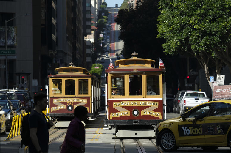 AP19254689092171 A cable car at right begins to make its way up California Street Wednesday, Sept. 11, 2019, in San Francisco. (AP Photo/Eric Risberg)