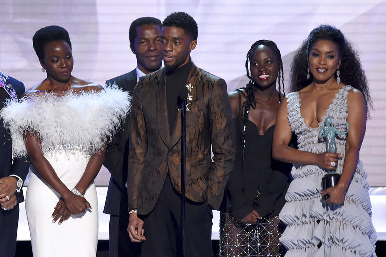 AP19028112838175 Danai Gurira, from left, Isaach de Bankole, Chadwick Boseman, Lupita Nyong'o and Angela Bassett from the cast of "Black Panther," accept the award for outstanding performance by a cast in a motion picture at the 25th annual Screen Actors Guild Awards at t