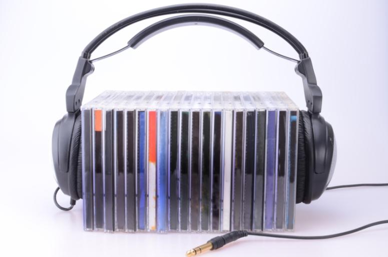 Headphones with stack of CDs Headphones with stack of CDs