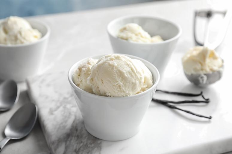 Bowls with tasty vanilla ice cream. Bowls with tasty vanilla ice cream.