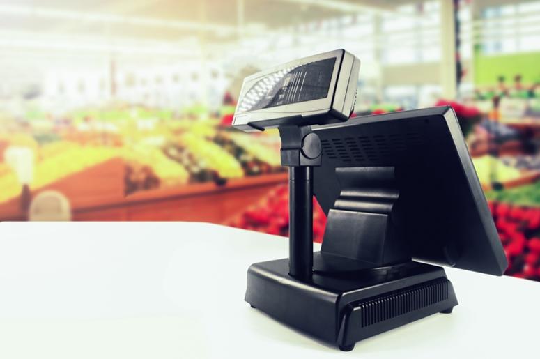 Cash register on desk at grocery store Cash register on desk at grocery store