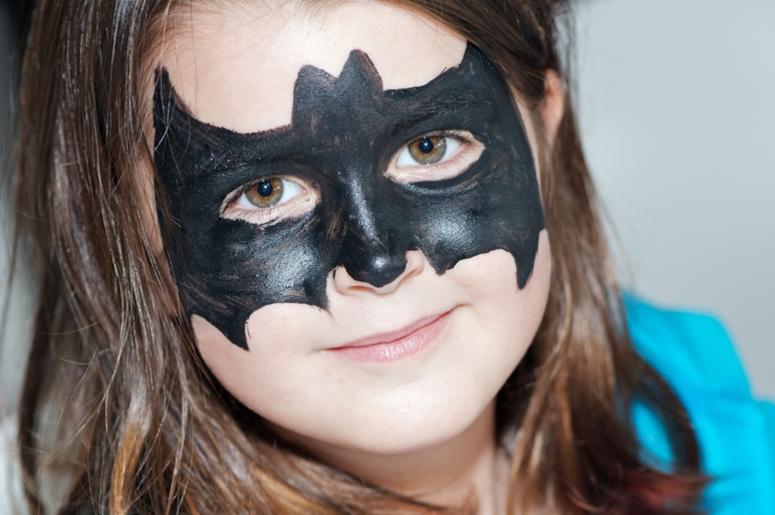 Child with bat face painting Child with bat face painting