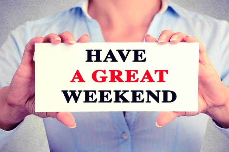 Businesswoman hands holding sign with have a great weekend text message Businesswoman hands holding sign with have a great weekend text message