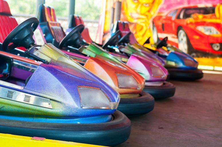 Colorful electric bumper car in the fairground attractions at amusement park Colorful electric bumper car in the fairground attractions at amusement park