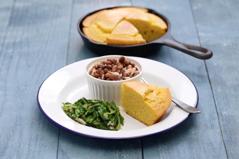 Beans and greens with cornbread, southern cooking. Golden, homemade. Beans and greens with cornbread, southern cooking. Golden, homemade.