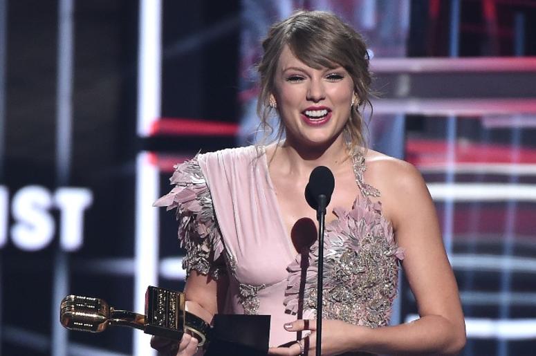 Taylor Swift accepts an award at the 2018 Billboard Music Awards at MGM Grand Garden Arena on May 20, 2018 in Las Vegas, Nevada. Taylor Swift accepts an award at the 2018 Billboard Music Awards at MGM Grand Garden Arena on May 20, 2018 in Las Vegas, Nevada.
