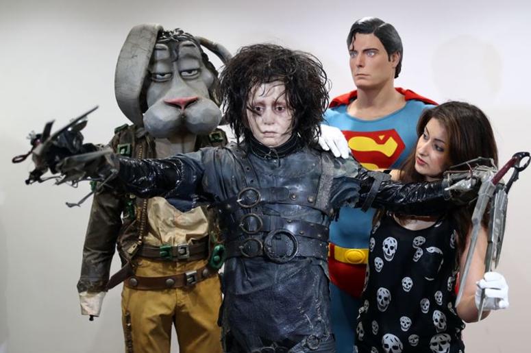 7/30/2018 - Prop Store employee Priya Mudgil (right) adjusts the costume of Edward Scissorhands (estimate £60-80,000) on display next to Christopher Reeve's Superman costume and Michael Jackson's 'Spike' costume from Moonwalker, at the Prop Store he 7/30/2018 - Prop Store employee Priya Mudgil (right) adjusts the costume of Edward Scissorhands (estimate £60-80,000) on display next to Christopher Reeve's Superman costume and Michael Jackson's 'Spike' costume from Moonwalker, at the Prop Store he