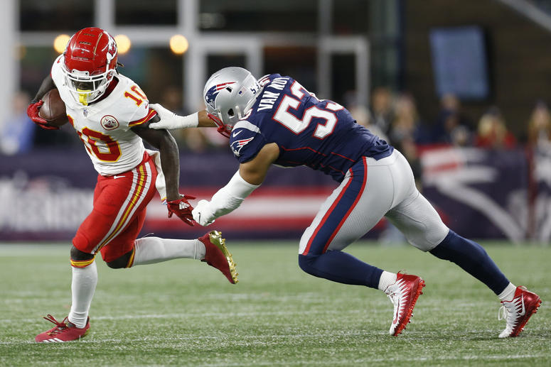 Oct 14, 2018; Foxborough, MA, USA; Kansas City Chiefs wide receiver Tyreek Hill (10) runs the ball pursued by New England Patriots linebacker Kyle Van Noy (53) during the third quarter at Gillette Stadium. © Greg M. Cooper-USA TODAY Sports