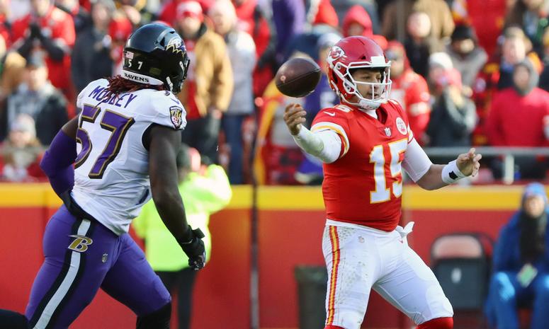 Dec 9, 2018; Kansas City, MO, USA; Kansas City Chiefs quarterback Patrick Mahomes (15) throws a pass as Baltimore Ravens linebacker C.J. Mosley (57) defends in the first half at Arrowhead Stadium. Mandatory Credit: Jay Biggerstaff-USA TODAY Sports