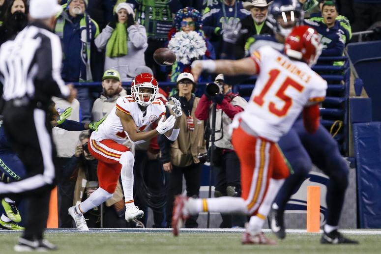Dec 23, 2018; Seattle, WA, USA; Kansas City Chiefs wide receiver Demarcus Robinson (11) catches an 11-yard touchdown pass from quarterback Patrick Mahomes (15) during the fourth quarter against the Seattle Seahawks at CenturyLink Field. Mandatory Credit: