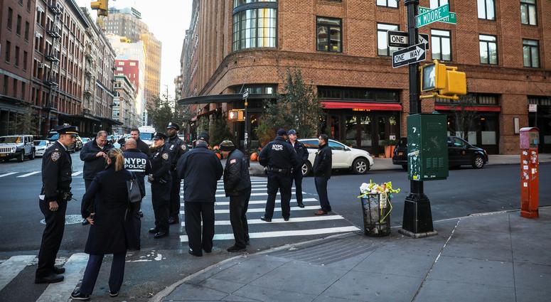 NEW YORK, NY - OCTOBER 25: Police gather near the scene of where another package bomb was found early Thursday morning at Robert De Niro's Tribeca Grill restaurant, October 25, 2018 in New York City. Initial news reports suggest that the package contained
