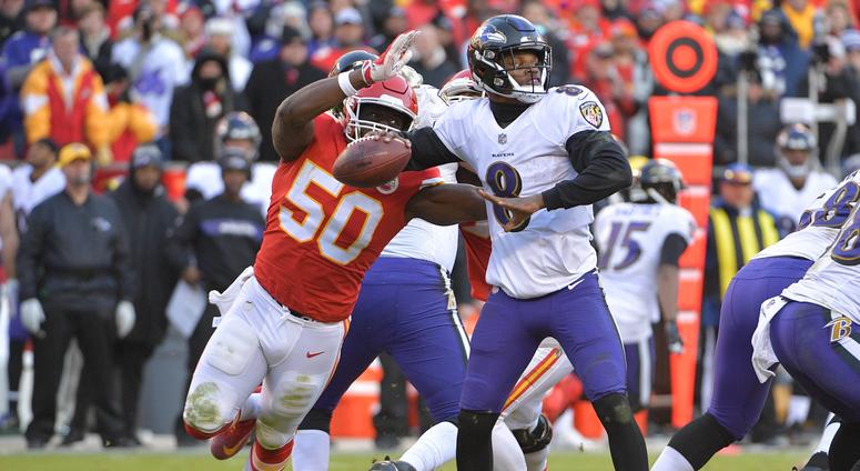 Dec 9, 2018; Kansas City, MO, USA; Kansas City Chiefs outside linebacker Justin Houston (50) strips the ball from Baltimore Ravens quarterback Lamar Jackson (8) during the second half at Arrowhead Stadium. Mandatory Credit: Denny Medley-USA TODAY Sports
