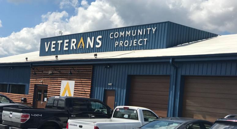 Cars sit outside the headquarters of the Veterans Community Project in Kansas City