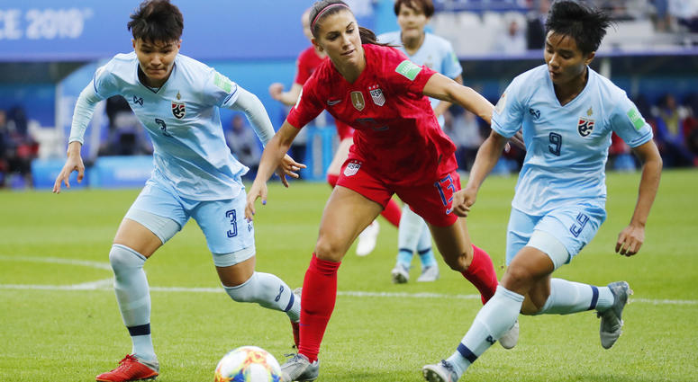Jun 11, 2019; Reims, FRANCE; United States forward Alex Morgan (13) is defended by Thailand defender Natthakarn Chinwong (3) and defender Warunee Phetwiset (9) during the first half in group stage play during the FIFA Women's World Cup France 2019 at Stad