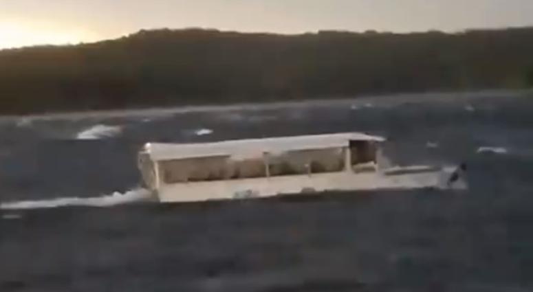 A duck boat is seen struggling through choppy waters on Table Rock Lake moments before it capsized, killing 17 people on board