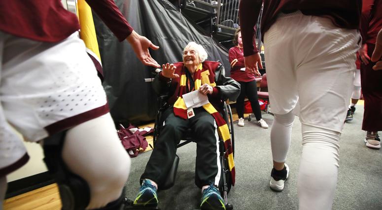 Loyola Ramblers team chaplain, Sister Jean Dolores Schmidt, 98, high fives Loyola players, Loyola Ramblers team chaplain, Sister Jean Dolores Schmidt, 98, high fives Loyola players,