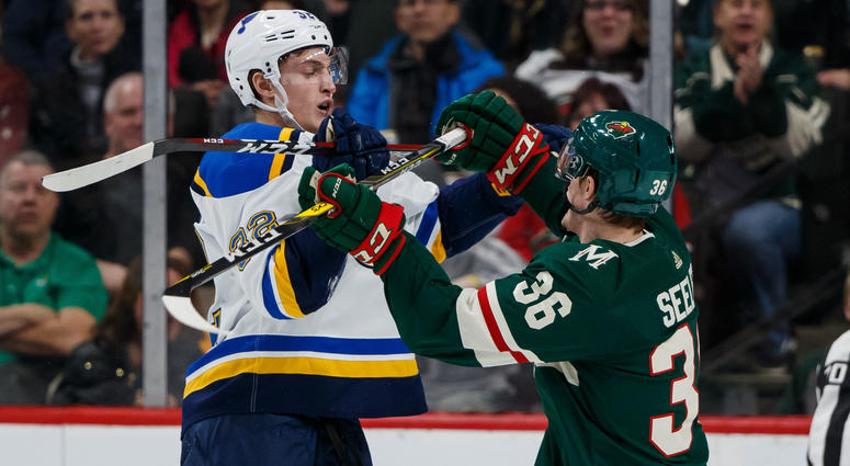 St Louis Blues forward Tage Thompson (32) and Minnesota Wild defenseman Nick Seeler St Louis Blues forward Tage Thompson (32) and Minnesota Wild defenseman Nick Seeler