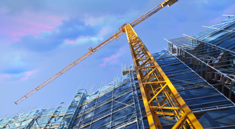 Construction Crane Yellow construction crane on building site