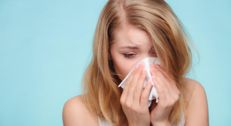 Flu woman sneezing