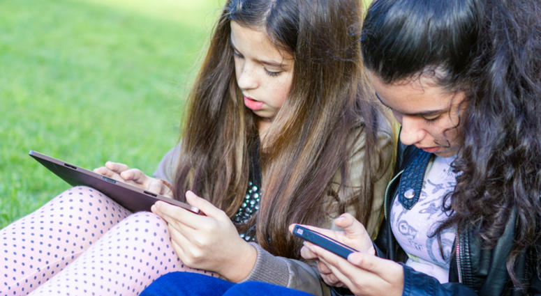 social media, kids Young girls having fun posting on social media