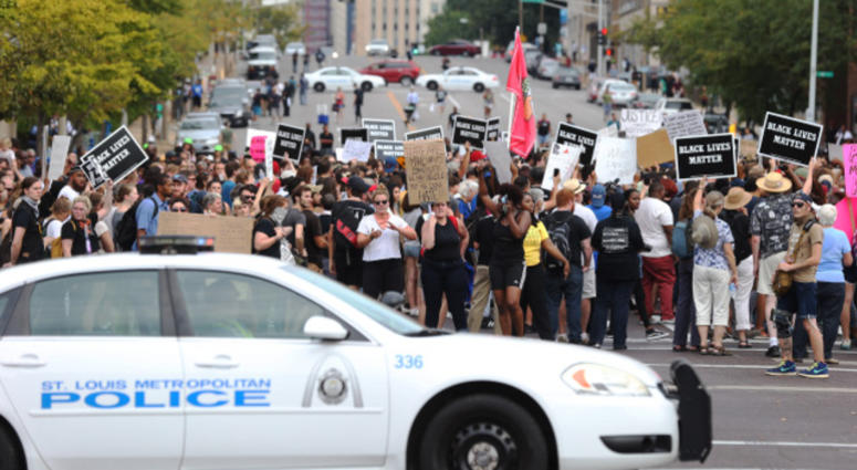 Police block the streets for protesters during a peaceful protest outside of St. Louis Metropolitian Police Headquarters in St. Louis on September 17, 2017.