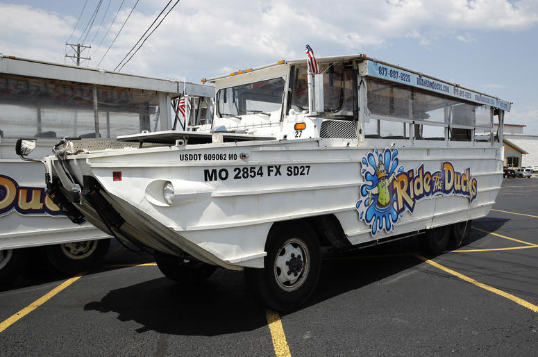 A duck boat sits idle in the parking lot of Ride the Ducks, an amphibious tour operator in Branson, Mo. Friday, July 20, 2018.