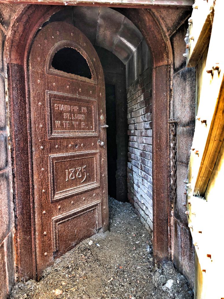 Entry door to "Red Tower." Hidden by a wood door for years, you can see the pigeon droppings and debris of the years at door's base. Photo by D. Monterrey Entry door to "Red Tower." Hidden by a wood door for years, you can see the pigeon droppings and debris of the years at door's base. Photo by D. Monterrey