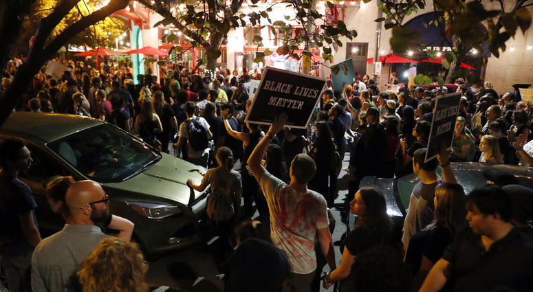 FILE - In this Sept. 15, 2017 file photo, protesters gather, in St. Louis, after a judge found Jason Stockley, a white former St. Louis police officer, not guilty of first-degree murder in the death of Anthony Lamar Smith, a black man.