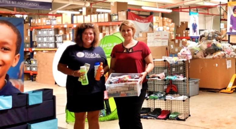 At the Little Bit Foundation: Lucy England with Debbie Monterrey American Eagle Credit Union personal hygiene drive for Little Bit Foundation