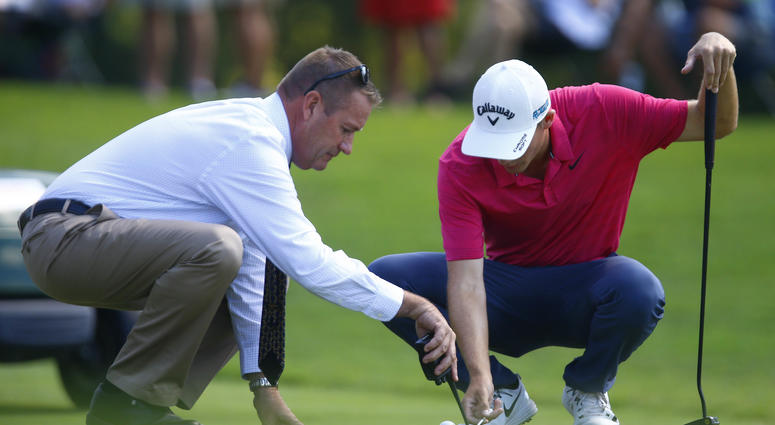 Aaron Wise gets a ruling from the official on the fifth hole during the second round of the Tour Championship Aaron Wise gets a ruling from the official on the fifth hole during the second round of the Tour Championship