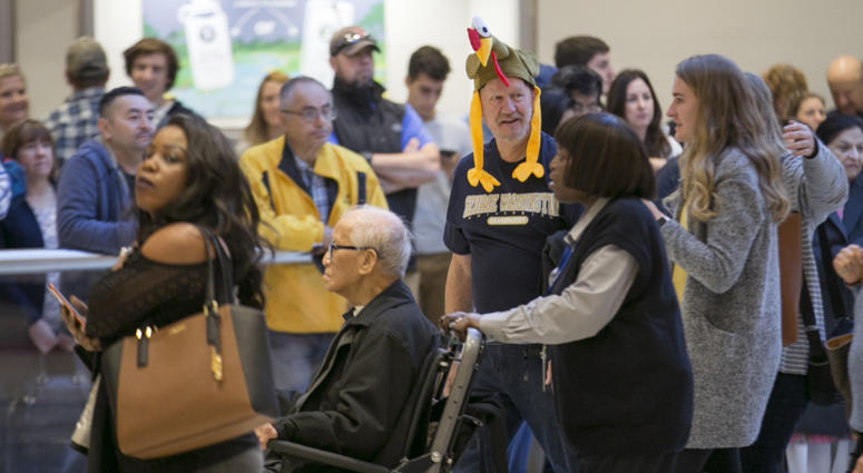 Arriving passengers head toward the baggage claim area at Hartsfield-Jackson Atlanta International airport on Wednesday, Nov. 22, 2017.