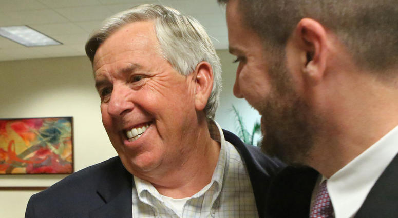 Mike Parson, left, celebrates his election as Lieutenant Governor of Missouri, on November 8, 2016, at the Oasis Convention Center in Springfield, Mo.