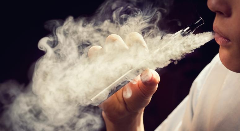 teen using e-cigarette vaporizer