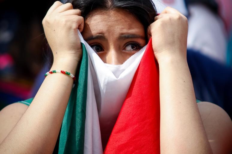 El Tri Nomas No Puede Ganarle A Chile A fan reacts while watching a live broadcast of the 2018 FIFA World Cup round of 16 match between Brazil and Mexico, at the Zocalo Square in Mexico City, capital of Mexico, July 2, 2018. (Xinhua/Francisco Canedo) (da) (rtg) (ce)