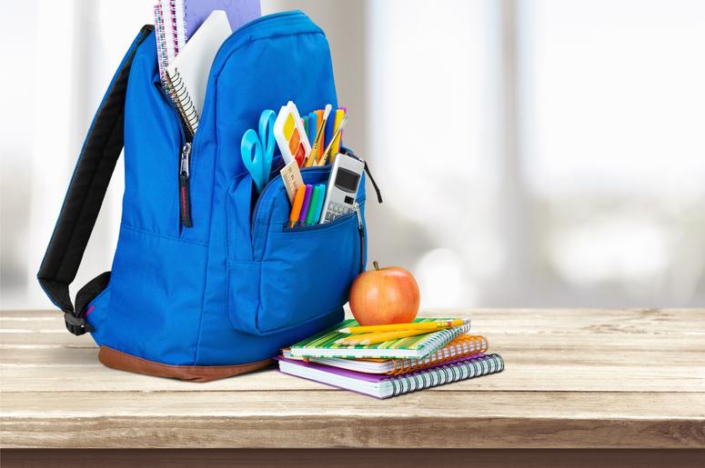 Photo of a backpack at school. Photo of a backpack at school.