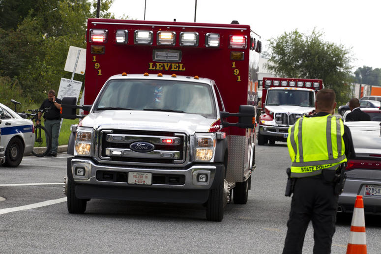 Ambulance leave the industrial park where several people had been shot, according with police reports in Aberdeen, Md,