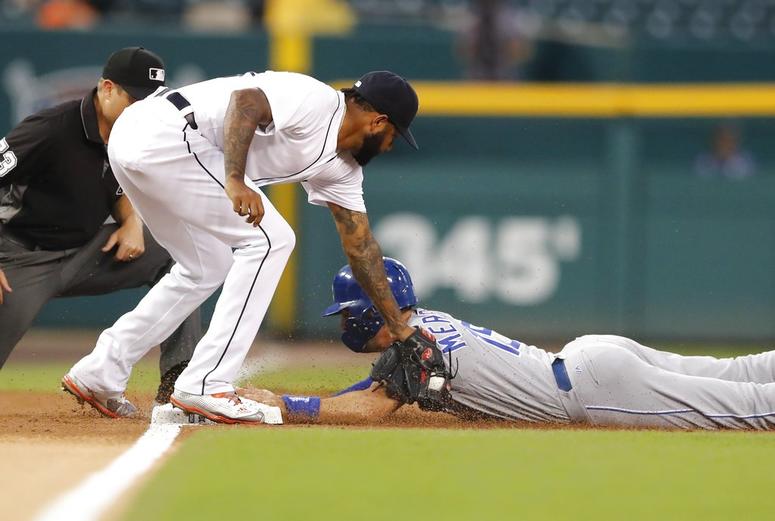 Kansas City Royals' Whit Merrifield beats the tag of Detroit Tigers third baseman Ronny Rodriguez and steals third during the first inning