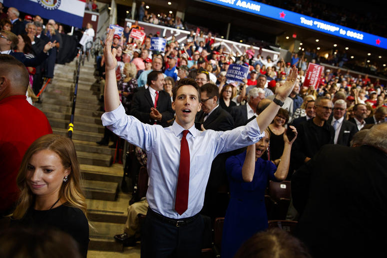 Republican Senate candidate Josh Hawley dances before President Donald Trump speaks during a campaign rally