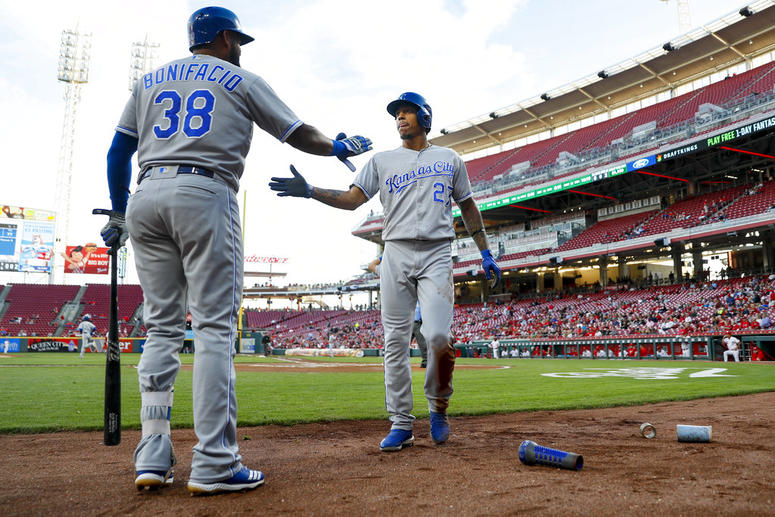 Kansas City Royals' Adalberto Mondesi (27) celebrates with Jorge Bonifacio (38) after scoring on a double by Salvador Perez off Cincinnati Reds starting pitcher Cody Reed during the first inning
