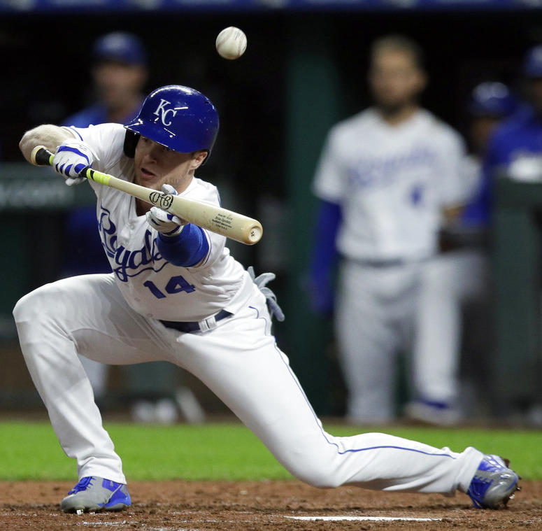 Kansas City Royals' Brett Phillips (14) bunts out to Cleveland Indians catcher Yan Gomes during the fifth inning