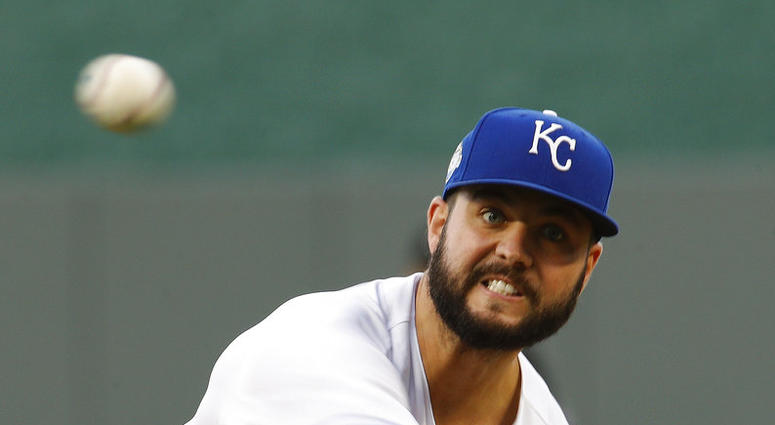 Kansas City Royals starting pitcher Jakob Junis throws during the first inning of a baseball game against the Detroit Tigers