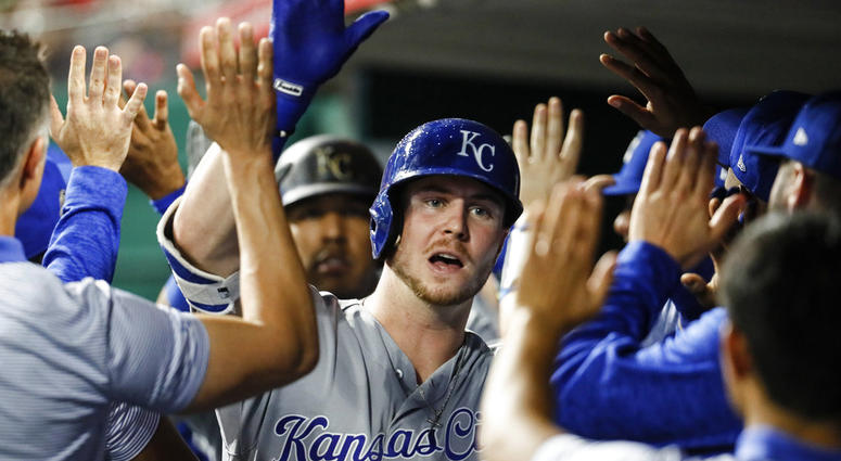 Kansas City Royals' Ryan O'Hearn celebrates in the dugout after hitting a two-run home run off Cincinnati Reds starting pitcher Matt Harvey
