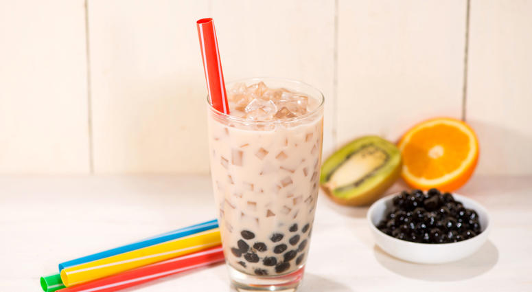 A glass of bubble tea with milk