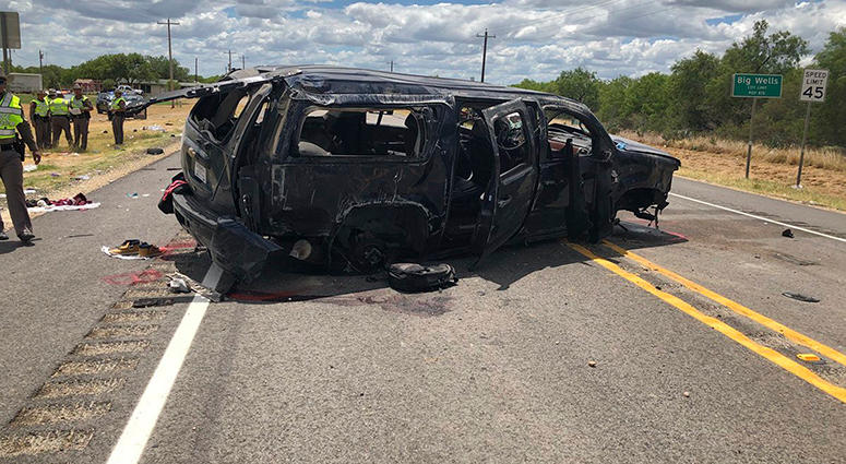 In this image tweeted by David Caltabiano of KABB/WOAI, a heavily damaged SUV is seen on Texas Highway 85 in Big Wells, Texas, after crashing while carrying more than a dozen people fleeing from Border Patrol agents In this image tweeted by David Caltabiano of KABB/WOAI, a heavily damaged SUV is seen on Texas Highway 85 in Big Wells, Texas, after crashing while carrying more than a dozen people fleeing from Border Patrol agents